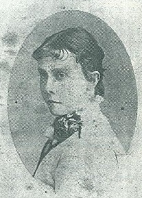 Black and white photo of Lily Poulett-Harris. She is facing side on to the camera.